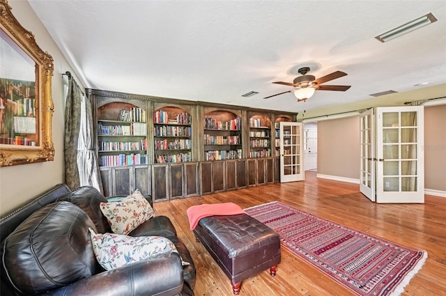 1509 Shadow Ridge Cir, Sarasota, FL 34240 - living room featuring french doors, wood finished floors, and a ceiling fan