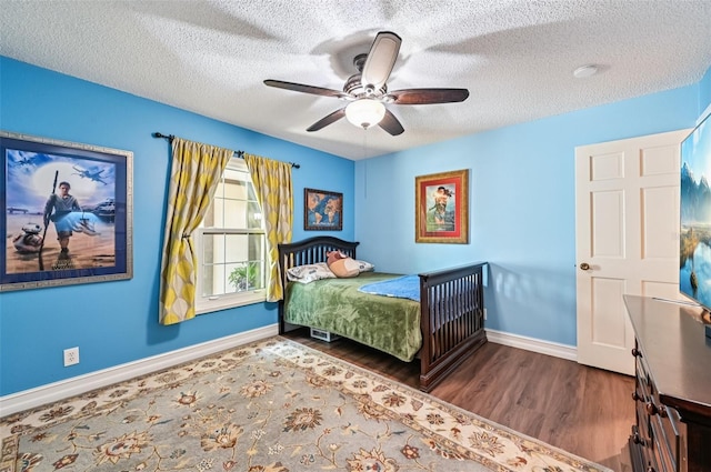 1509 Shadow Ridge Cir, Sarasota, FL 34240 - bedroom featuring wood finished floors, a textured ceiling, and a ceiling fan