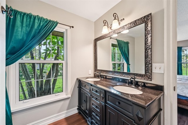 1509 Shadow Ridge Cir, Sarasota, FL 34240 - bathroom featuring double vanity and wood finished floors