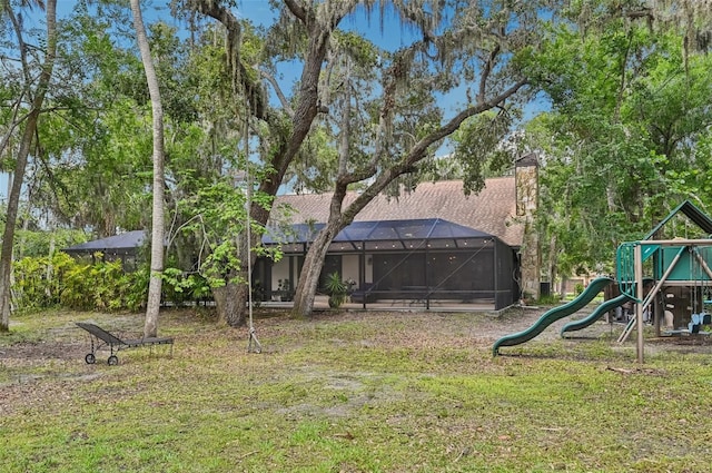 1509 Shadow Ridge Cir, Sarasota, FL 34240 - view of green lawn featuring a playground and a lanai