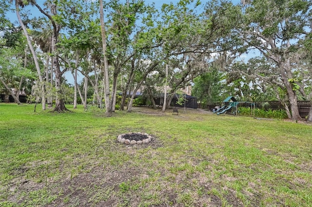 1509 Shadow Ridge Cir, Sarasota, FL 34240 - view of yard featuring a playground and an outdoor fire pit