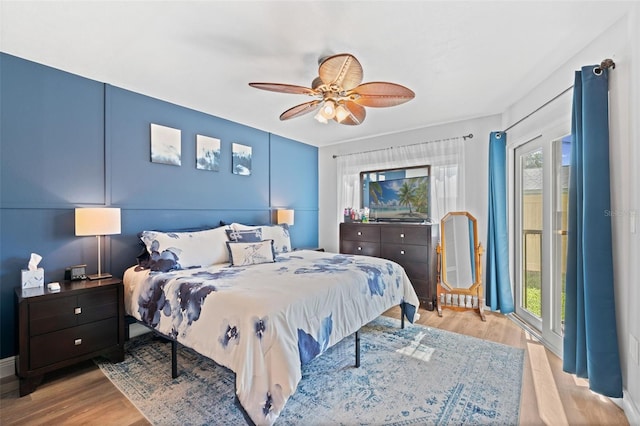 2415 Bayshore Gardens Pkwy Unit 2, Bradenton, FL 34207 - bedroom with wood finished floors, multiple windows, and a ceiling fan