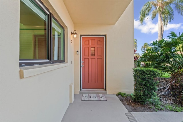 2415 Bayshore Gardens Pkwy Unit 2, Bradenton, FL 34207 - doorway to property featuring stucco siding