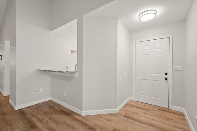 4333 Trails Dr Unit 10-1, Sarasota, FL 34232 - entrance foyer with light wood-style flooring and baseboards