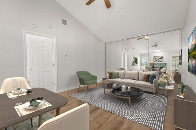 4333 Trails Dr Unit 10-1, Sarasota, FL 34232 - living room with a ceiling fan, wood finished floors, and high vaulted ceiling