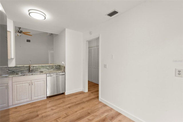 4333 Trails Dr Unit 10-1, Sarasota, FL 34232 - kitchen with dishwasher, ceiling fan, light wood-style floors, and light stone countertops