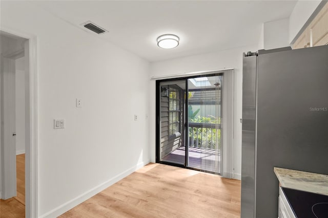 4333 Trails Dr Unit 10-1, Sarasota, FL 34232 - unfurnished dining area with light wood-style floors and baseboards