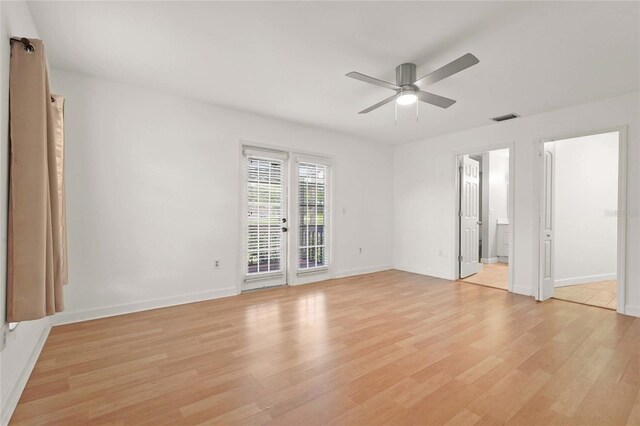 4333 Trails Dr Unit 10-1, Sarasota, FL 34232 - unfurnished bedroom with light wood-style floors, access to outside, a ceiling fan, and french doors