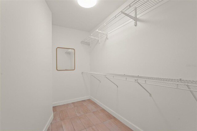4333 Trails Dr Unit 10-1, Sarasota, FL 34232 - walk in closet with light wood-style floors