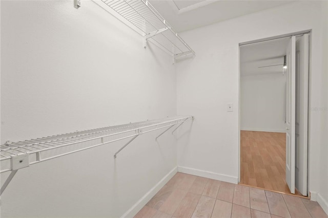 4333 Trails Dr Unit 10-1, Sarasota, FL 34232 - walk in closet featuring light wood finished floors