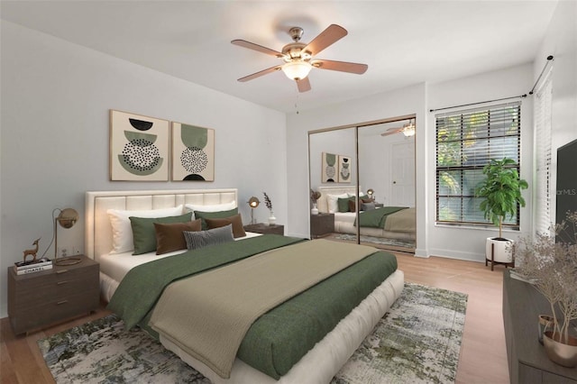 4333 Trails Dr Unit 10-1, Sarasota, FL 34232 - bedroom featuring wood finished floors, a ceiling fan, and a closet