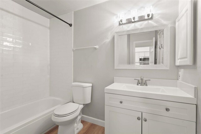 4333 Trails Dr Unit 10-1, Sarasota, FL 34232 - bathroom with vanity, wood finished floors, and shower / tub combination