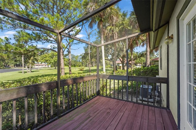 4333 Trails Dr Unit 10-1, Sarasota, FL 34232 - unfurnished sunroom featuring view of scattered trees