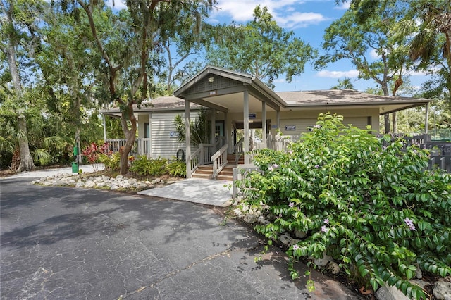 4333 Trails Dr Unit 10-1, Sarasota, FL 34232 - view of front of property featuring a porch and a garage