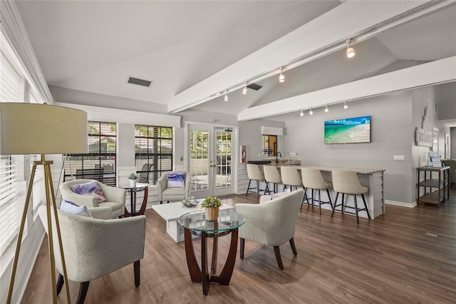 4333 Trails Dr Unit 10-1, Sarasota, FL 34232 - living room with track lighting, vaulted ceiling, wood finished floors, and french doors