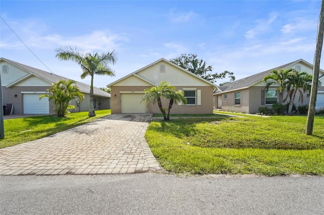 3362 Howell Pl, Sarasota, FL 34232 - single story home with decorative driveway, a front yard, and stucco siding