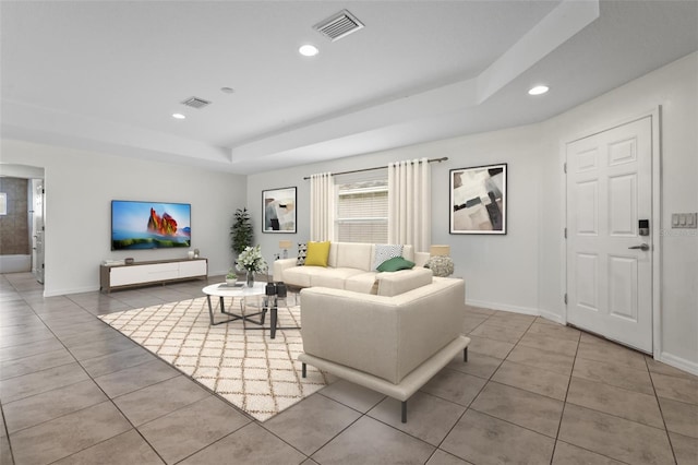 3362 Howell Pl, Sarasota, FL 34232 - living room featuring a raised ceiling, tile patterned floors, and recessed lighting
