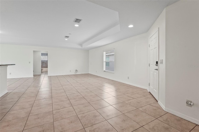 3362 Howell Pl, Sarasota, FL 34232 - empty room featuring recessed lighting, light tile patterned flooring, and a tray ceiling