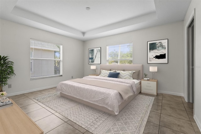 3362 Howell Pl, Sarasota, FL 34232 - tiled bedroom featuring a tray ceiling