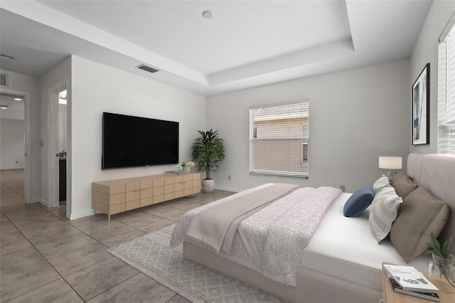 3362 Howell Pl, Sarasota, FL 34232 - bedroom with tile patterned floors and a tray ceiling