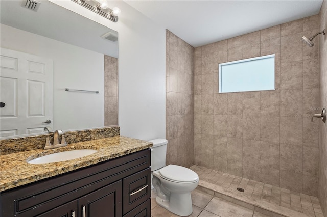 3362 Howell Pl, Sarasota, FL 34232 - full bath with a tile shower, vanity, and tile patterned flooring