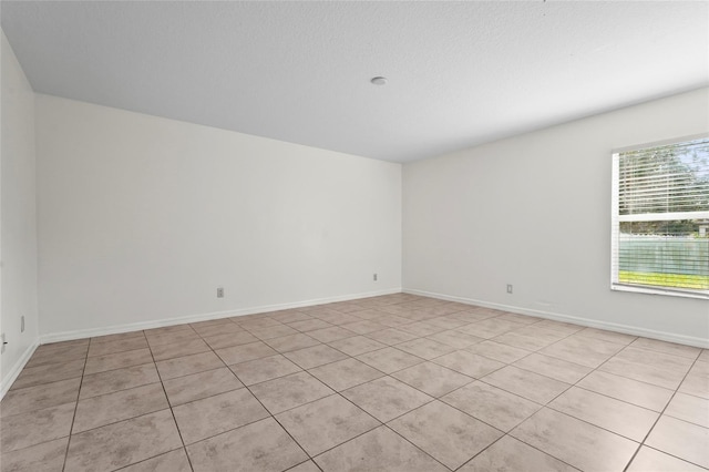 3362 Howell Pl, Sarasota, FL 34232 - unfurnished room with light tile patterned flooring and baseboards