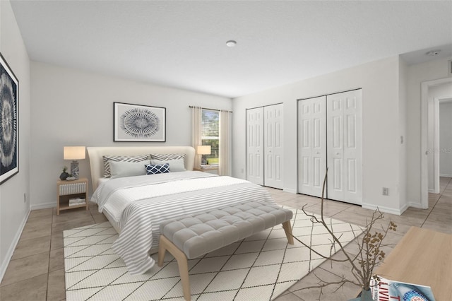 3362 Howell Pl, Sarasota, FL 34232 - bedroom featuring two closets and light tile patterned flooring