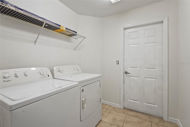 3362 Howell Pl, Sarasota, FL 34232 - laundry area featuring washer and clothes dryer and light tile patterned flooring