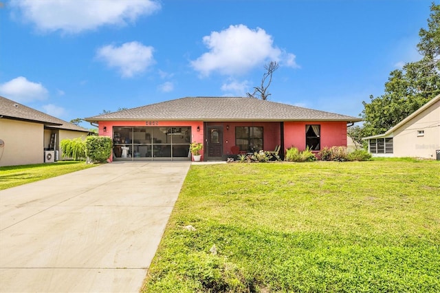 4145 W Price Blvd, North Port, FL 34286 - ranch-style house featuring concrete driveway, an attached garage, a front lawn, and stucco siding