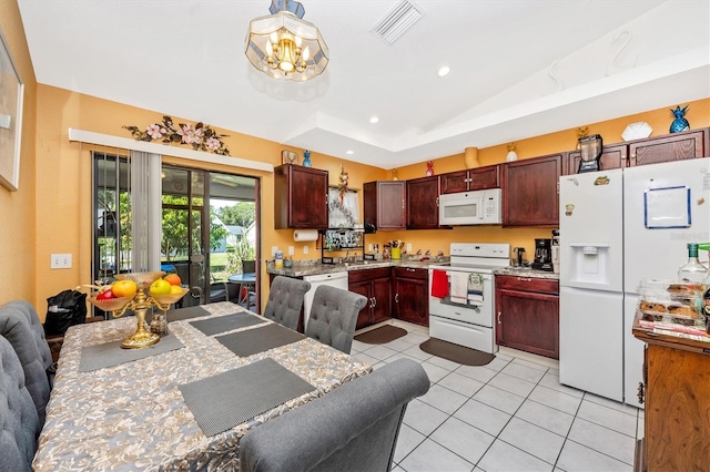 4145 W Price Blvd, North Port, FL 34286 - kitchen with white appliances, light tile patterned floors, light countertops, open floor plan, and recessed lighting