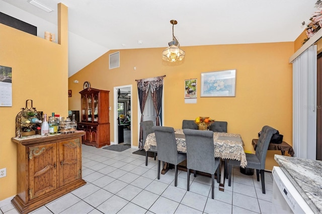 4145 W Price Blvd, North Port, FL 34286 - dining space featuring vaulted ceiling and light tile patterned floors