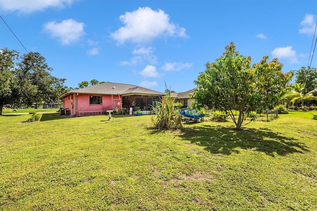 4145 W Price Blvd, North Port, FL 34286 - view of green lawn featuring a sunroom
