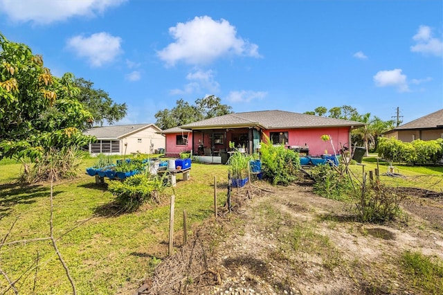4145 W Price Blvd, North Port, FL 34286 - back of house featuring a lawn, an outdoor living space, and ceiling fan