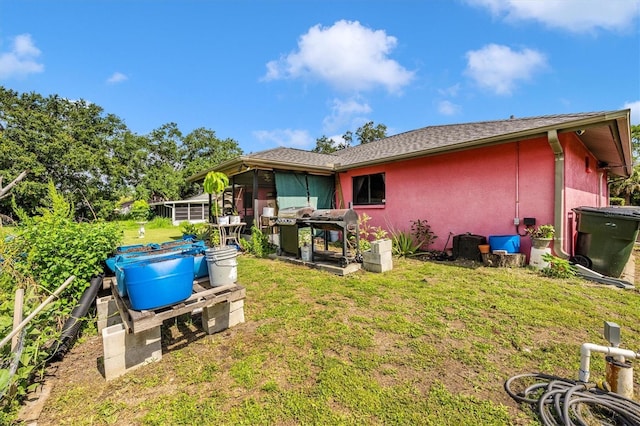 4145 W Price Blvd, North Port, FL 34286 - back of house featuring a lawn and stucco siding