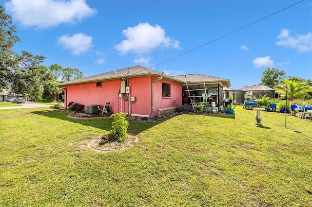 4145 W Price Blvd, North Port, FL 34286 - view of home's exterior with a yard, stucco siding, and a sunroom