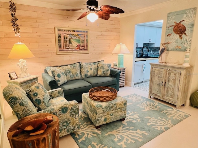 555 The Esplanade N Unit 202, Venice, FL 34285 - living area with ceiling fan, crown molding, and wooden walls