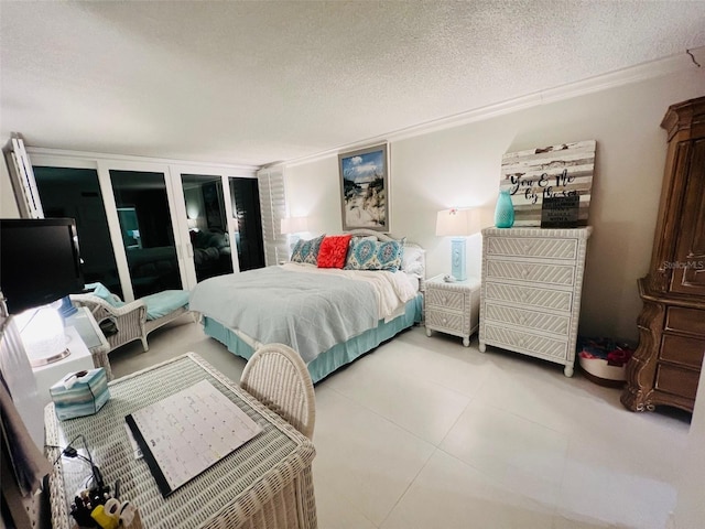 555 The Esplanade N Unit 202, Venice, FL 34285 - bedroom with a textured ceiling, ornamental molding, and tile patterned floors