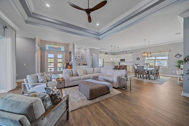 29527 Leah Rd, Punta Gorda, FL 33982 - living area featuring ceiling fan, a raised ceiling, wood finished floors, recessed lighting, and ornamental molding