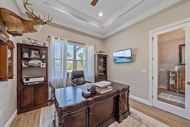 29527 Leah Rd, Punta Gorda, FL 33982 - home office featuring ornamental molding, a raised ceiling, light wood-style floors, and a ceiling fan