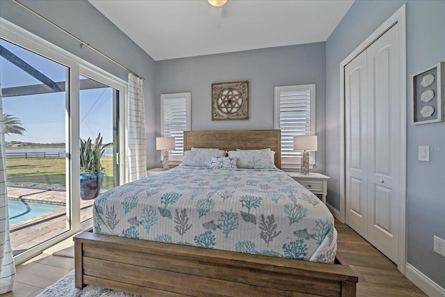 29527 Leah Rd, Punta Gorda, FL 33982 - bedroom with access to exterior, wood finished floors, and a closet