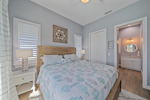 29527 Leah Rd, Punta Gorda, FL 33982 - bedroom with a closet, wood finished floors, ceiling fan, and ensuite bath