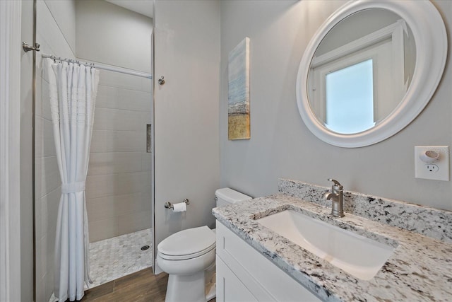 29527 Leah Rd, Punta Gorda, FL 33982 - bathroom featuring vanity, tiled shower, and wood finished floors