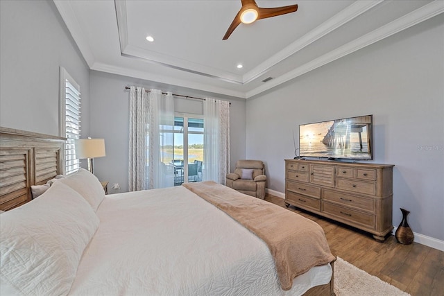 29527 Leah Rd, Punta Gorda, FL 33982 - bedroom with wood finished floors, a raised ceiling, access to exterior, a ceiling fan, and ornamental molding