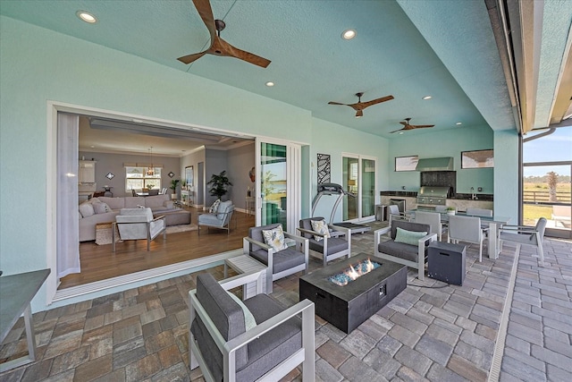 29527 Leah Rd, Punta Gorda, FL 33982 - view of patio / terrace with an outdoor kitchen, an outdoor living space with a fire pit, and ceiling fan
