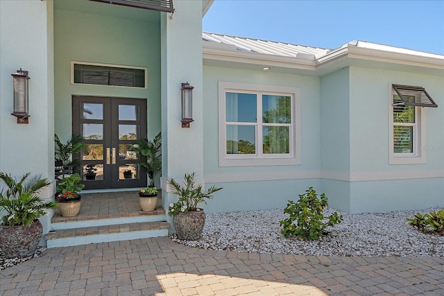 29527 Leah Rd, Punta Gorda, FL 33982 - entrance to property featuring french doors, a standing seam roof, stucco siding, and a metal roof