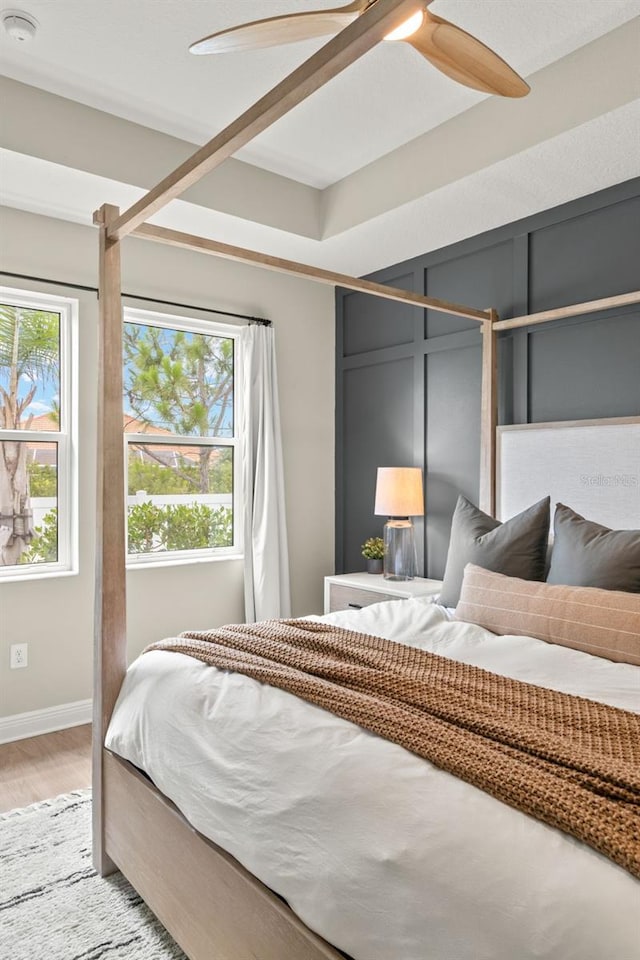 3621 Wild Blossom Pl, Parrish, FL 34219 - bedroom with light wood-style floors and ceiling fan