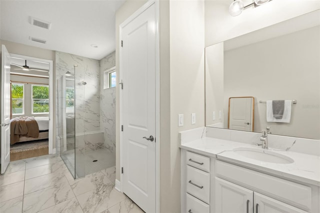 3621 Wild Blossom Pl, Parrish, FL 34219 - bathroom featuring a marble finish shower, vanity, marble look tile flooring, and ensuite bath