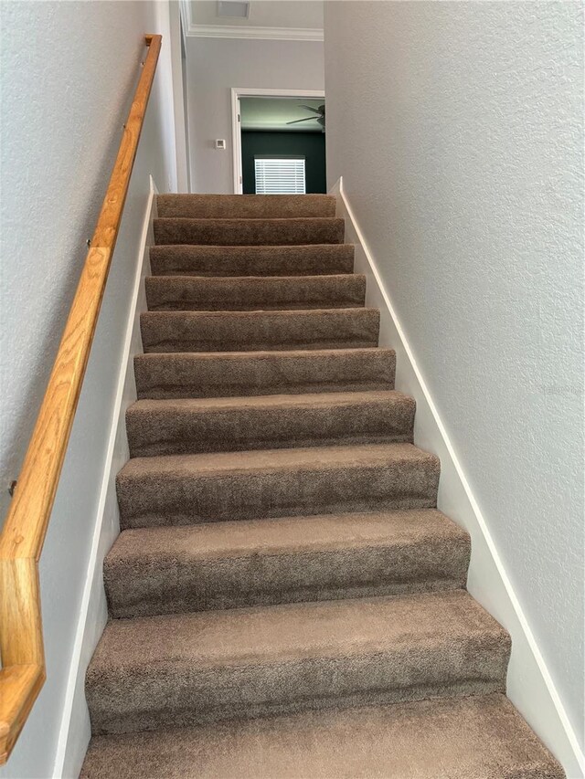 10054 Crooked Creek Dr Unit 201, Venice, FL 34293 - stairway with a textured wall and crown molding