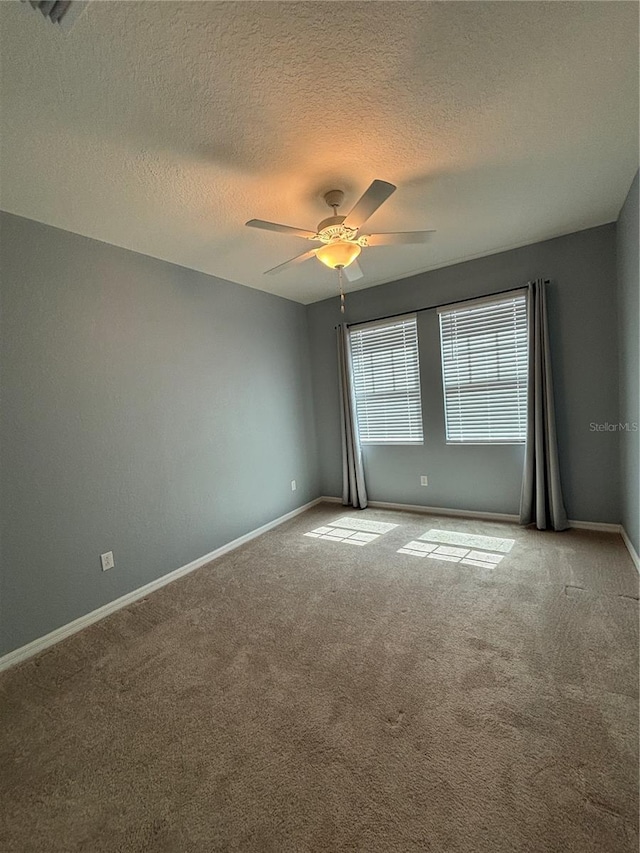 10054 Crooked Creek Dr Unit 201, Venice, FL 34293 - carpeted spare room featuring a ceiling fan and a textured ceiling