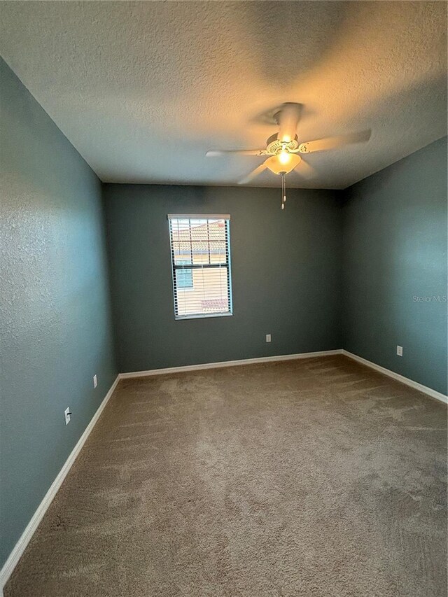 10054 Crooked Creek Dr Unit 201, Venice, FL 34293 - empty room with carpet floors, ceiling fan, and a textured ceiling